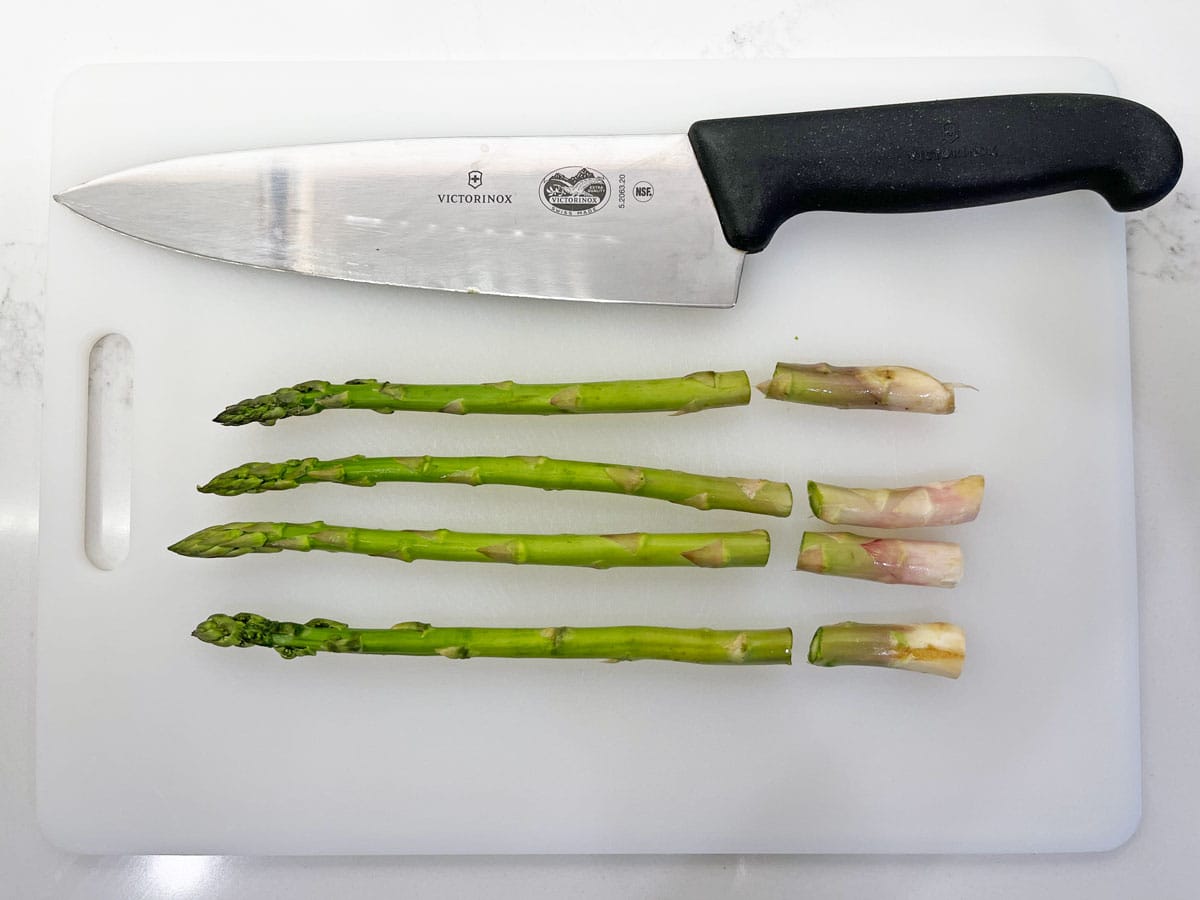 Trimming the asparagus ends.