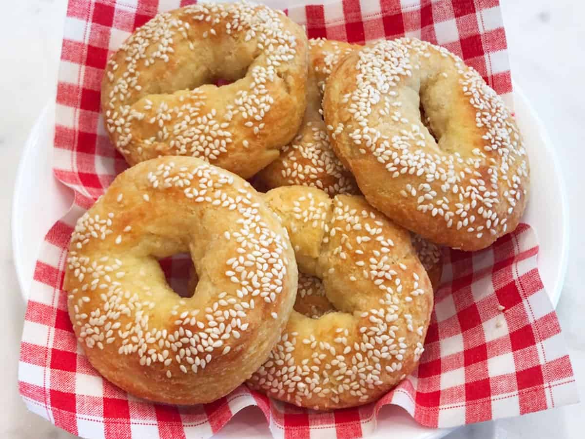 Serving the bagels in a basket or a napkin-lined bowl.