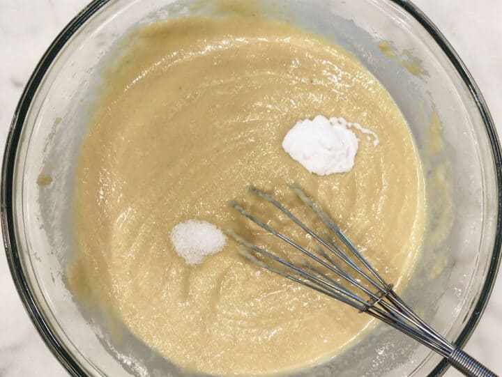 Adding salt and baking soda to the batter.