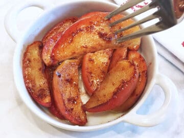 Baked apple slices are served.