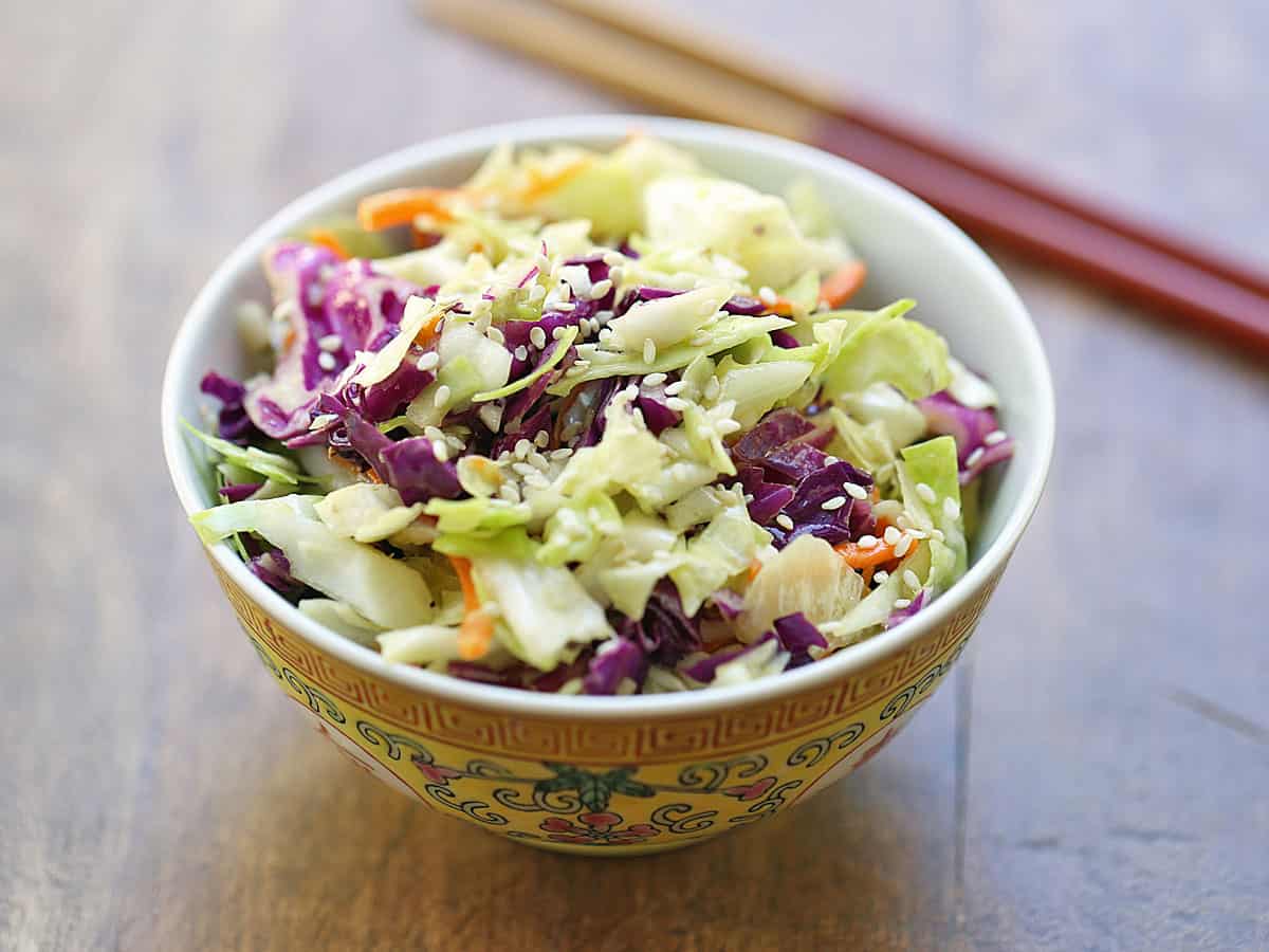 Asian cabbage salad is served in a Chinese bowl.