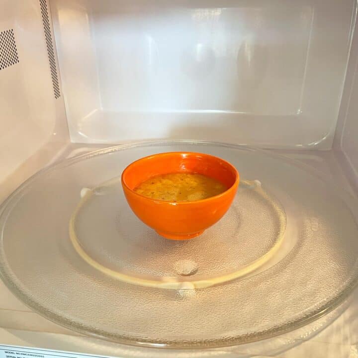 The bowl with the eggs is in the microwave.