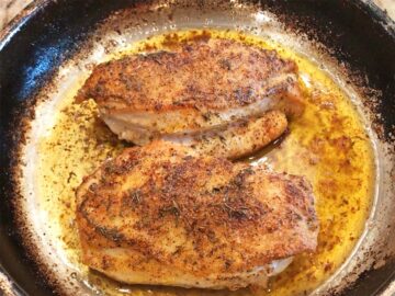 The chicken is ready in the skillet.