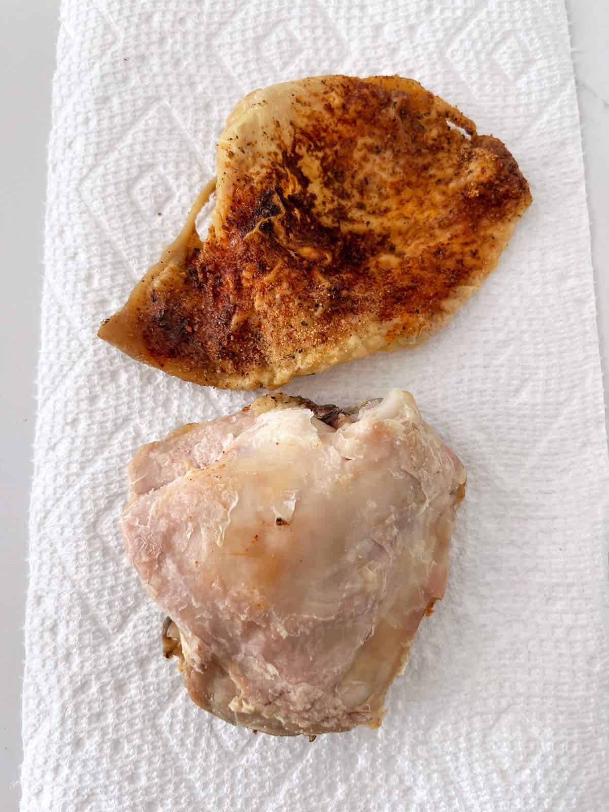 Removing the skin from leftover chicken thighs.