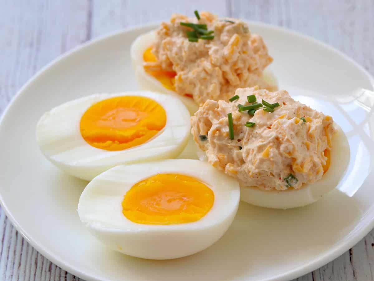Hard-boiled eggs are topped with a cream cheese dip.