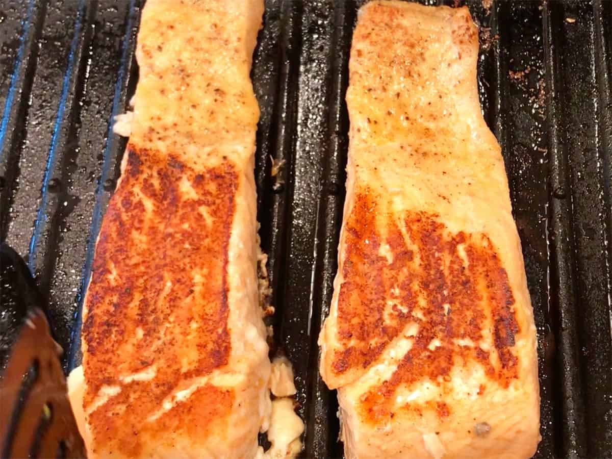 The salmon fillets were flipped on the grill.