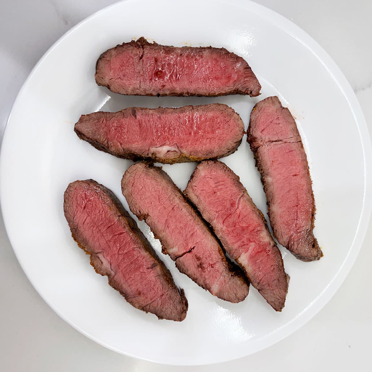 Reheated leftovers of a flat iron steak.