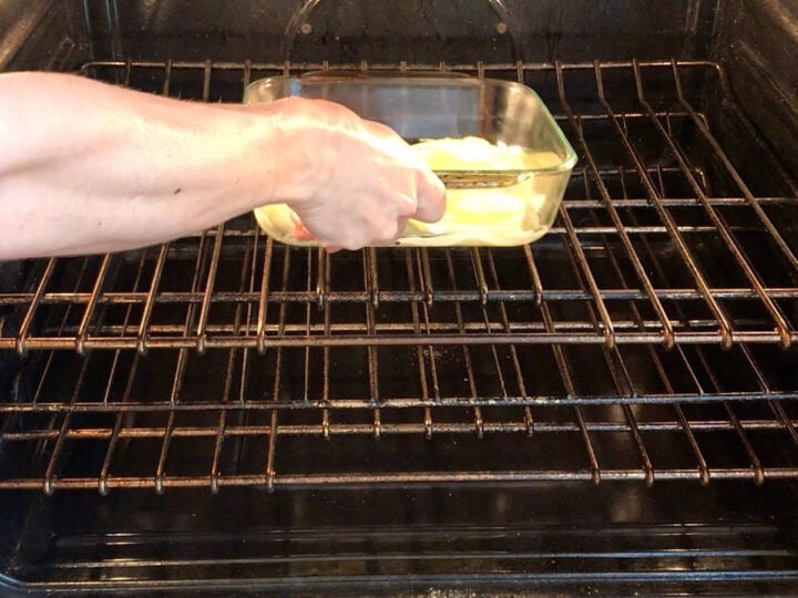 Placing the onions in the oven.