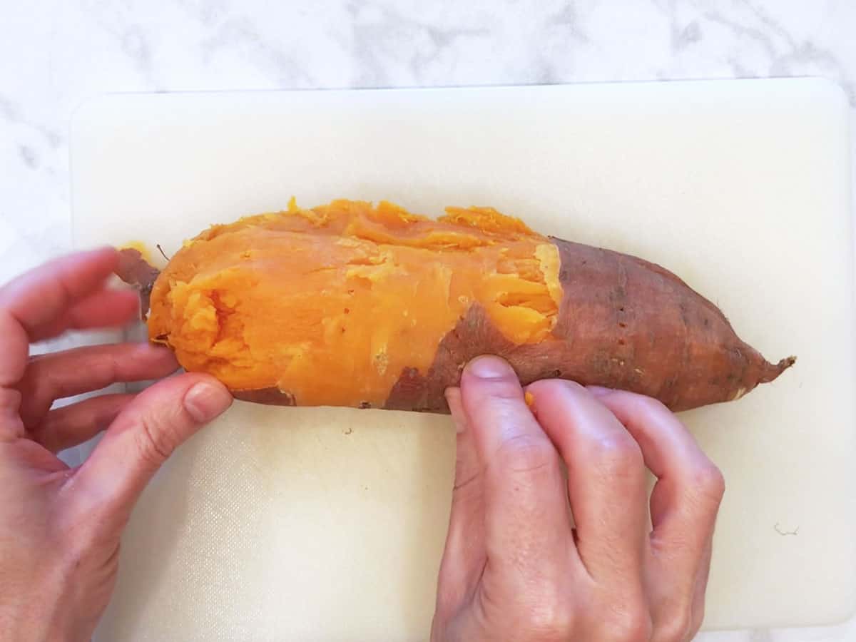 Peeling the sweet potato.