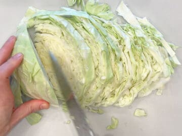 Slicing the cabbage.