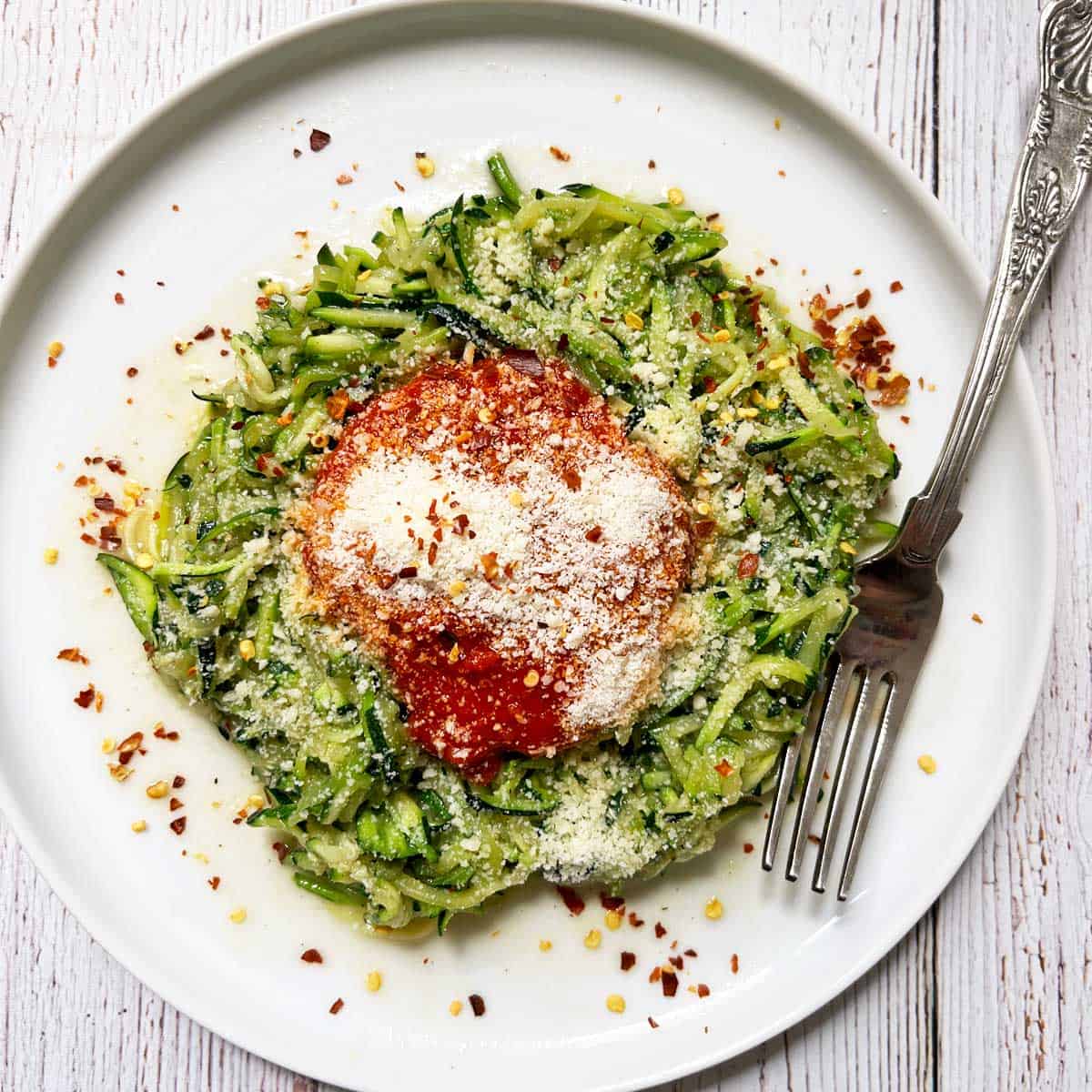 Zucchini noodles with marinara sauce and parmesan cheese.