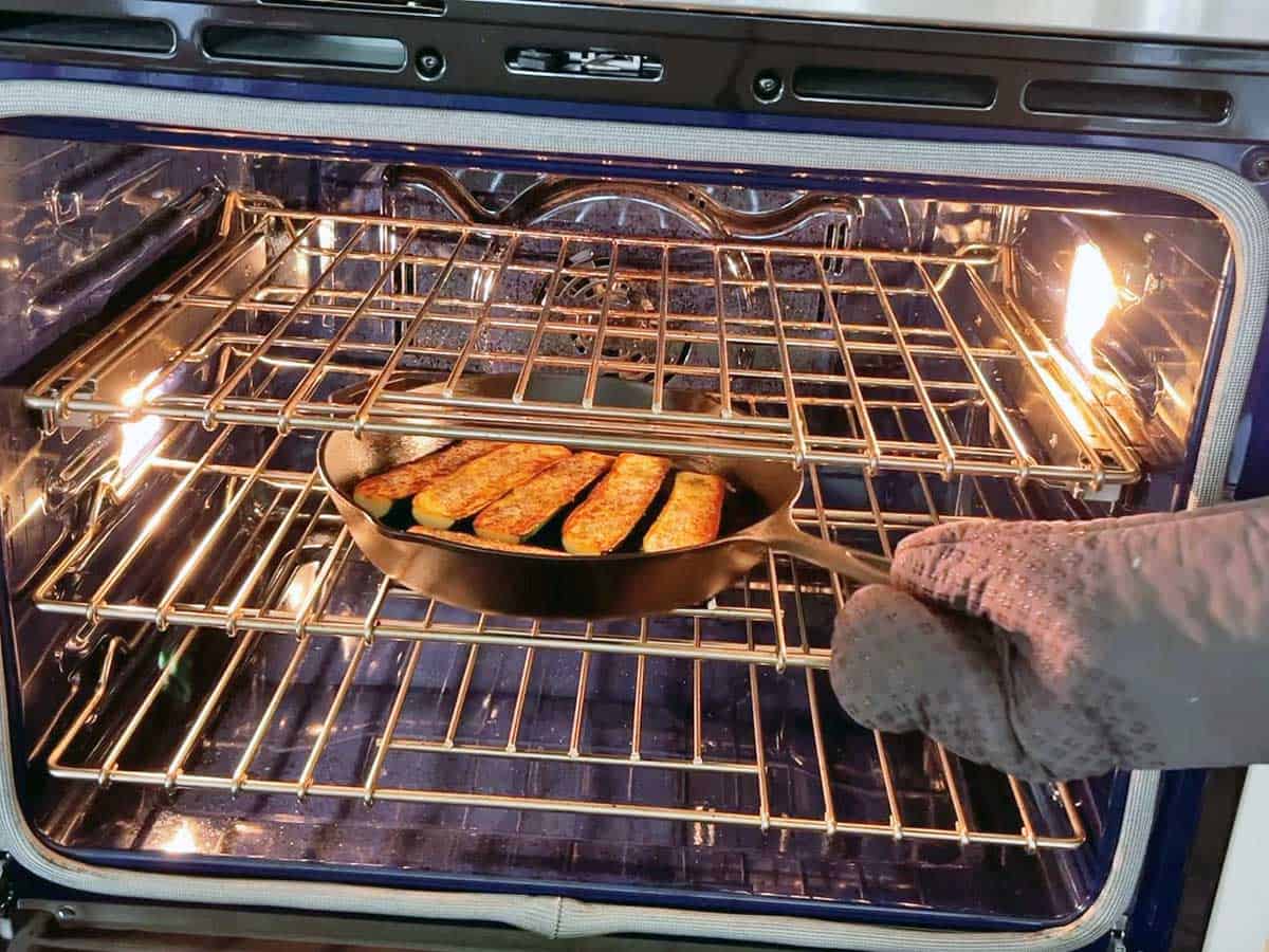 Placing the zucchini in the oven.