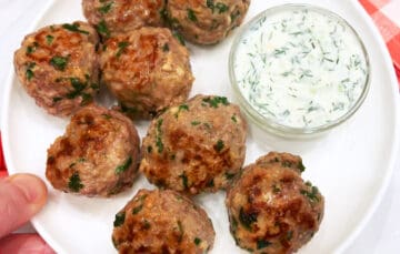 Lamb meatballs are served with a dip.