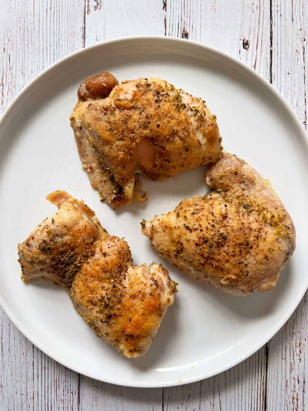 Boneless chicken thighs seasoned with Italian seasoning.
