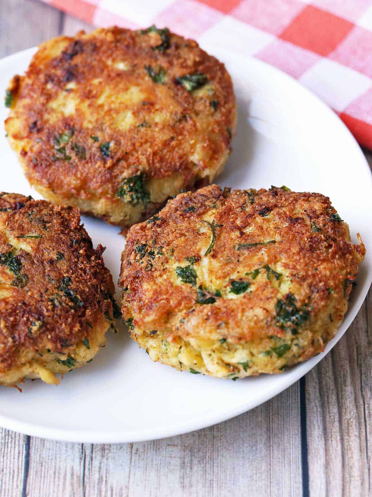 Three keto crab cakes are served on a plate.