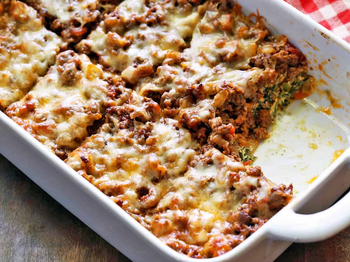 Keto lasagna is served in a white baking dish.