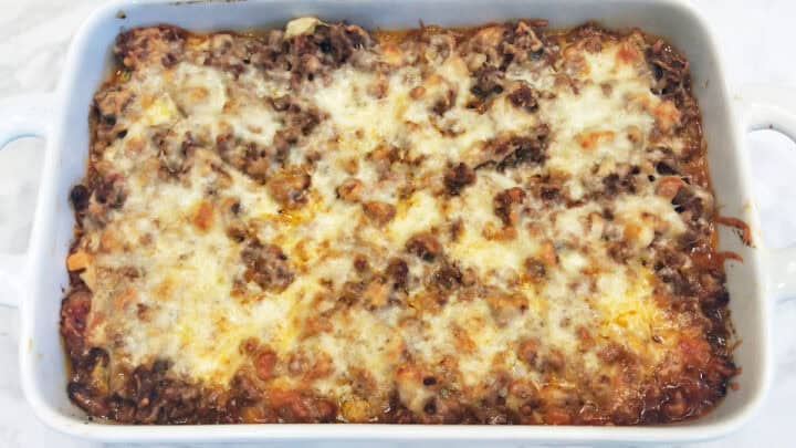 The lasagna is ready in the pan.