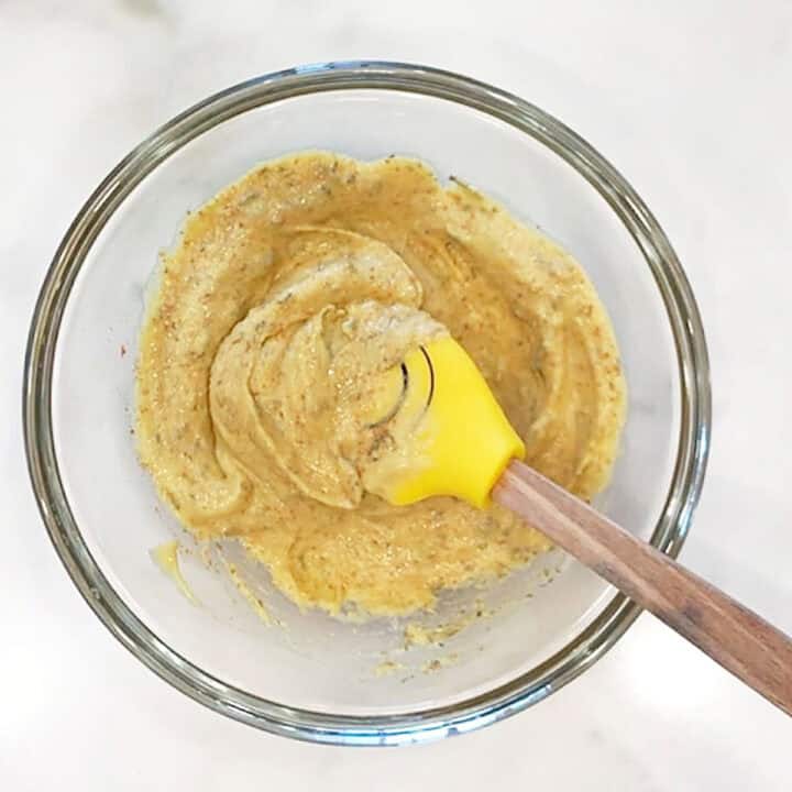 Mixing mustard and spices.
