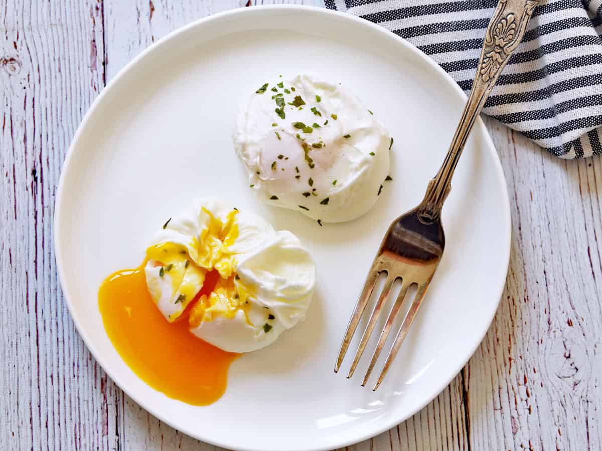 Two poached eggs on a plate.