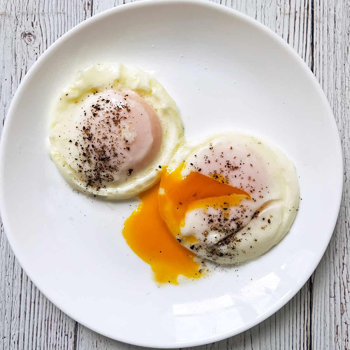 Two eggs that were poached in a stovetop egg poacher for three minutes.