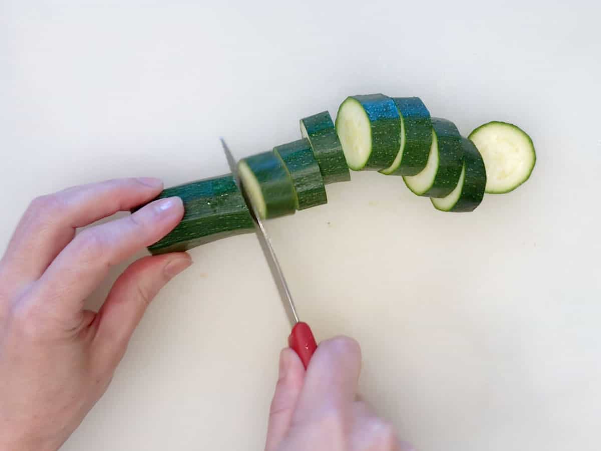 Slicing the zucchini.