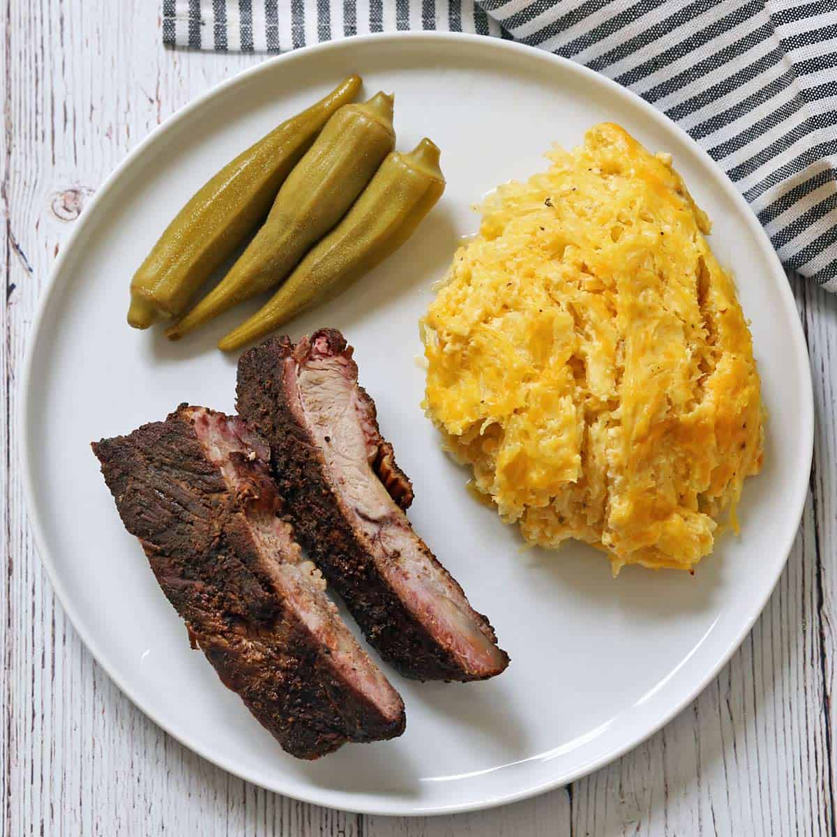 Spaghetti squash casserole is served with pork spare ribs and pickled okra.