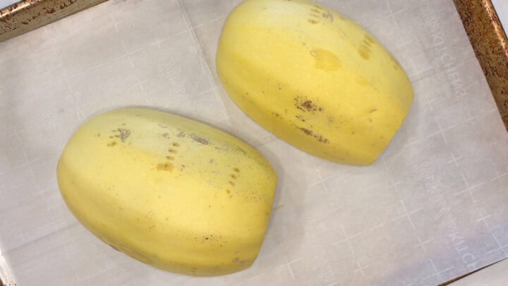 The squash halves were placed, cut-side-down, on a baking sheet.
