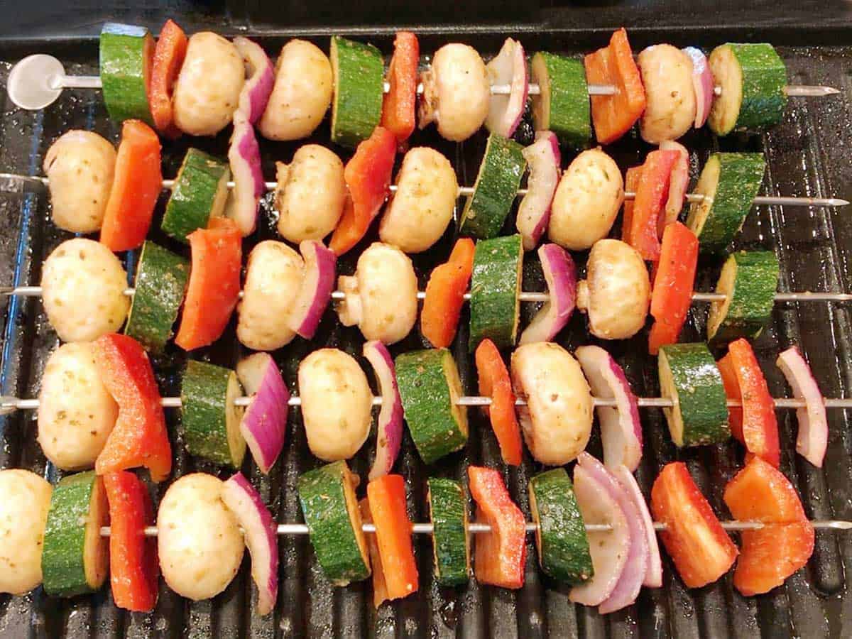 Veggie kabobs on the grill.