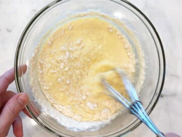 Adding flour to the mixture.