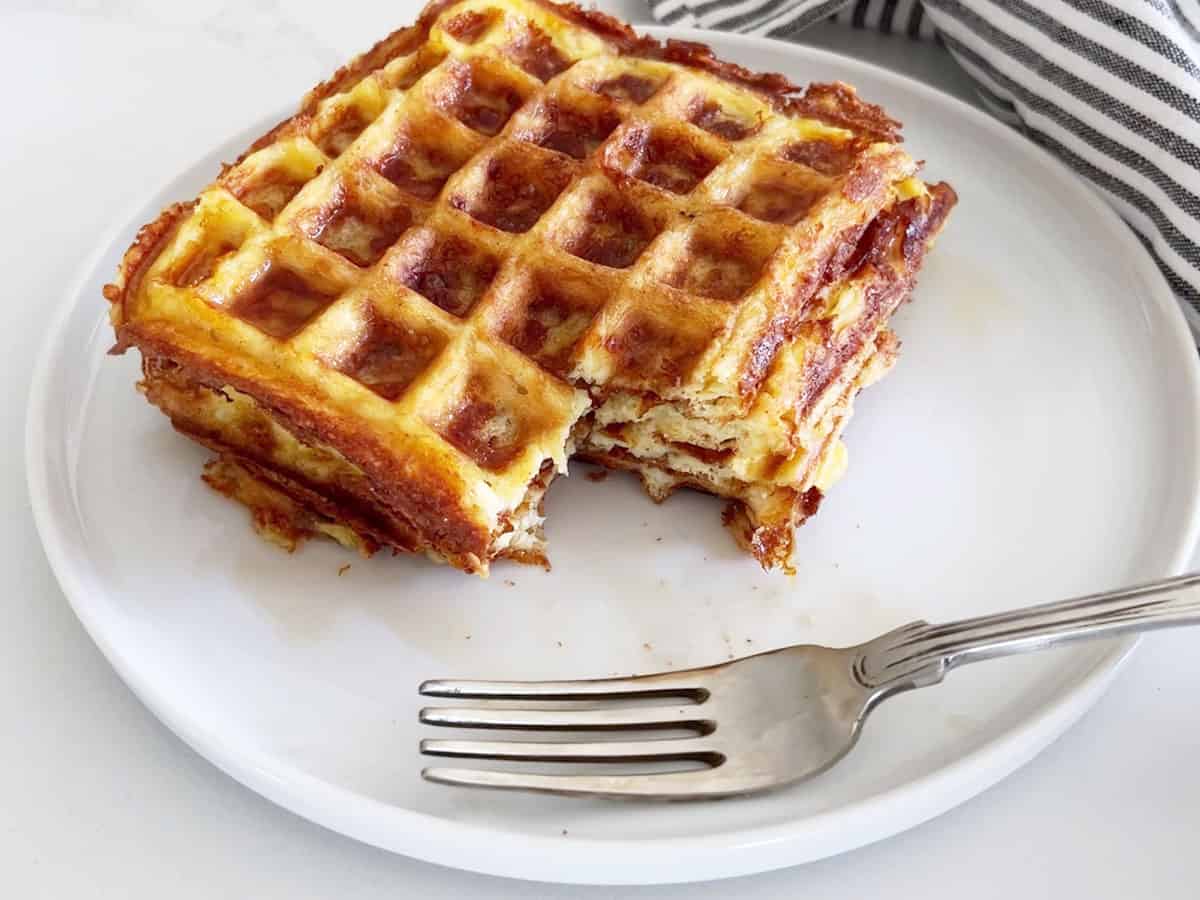 The chaffles are stacked on a plate.