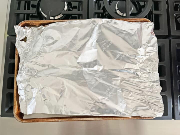 The pan was covered in foil to protect the chicken from burning.