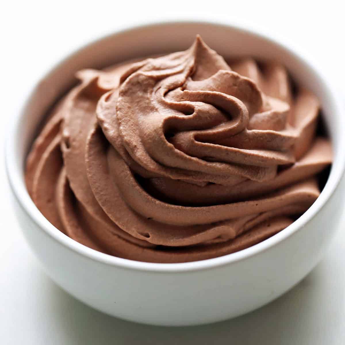 Chocolate whipped cream is served in a bowl.