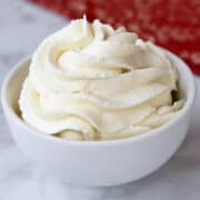 Keto whipped cream is served in a white bowl.