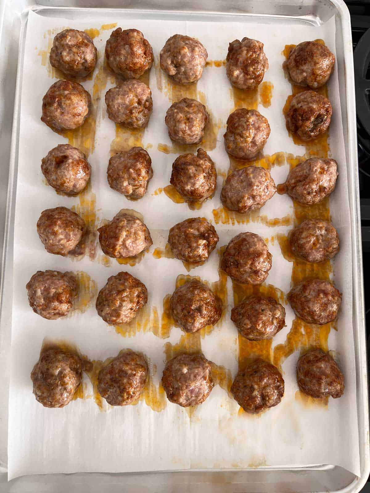 The meatballs are ready in the pan.