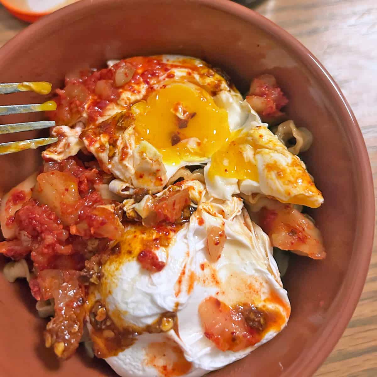 A meal topped with poached eggs.