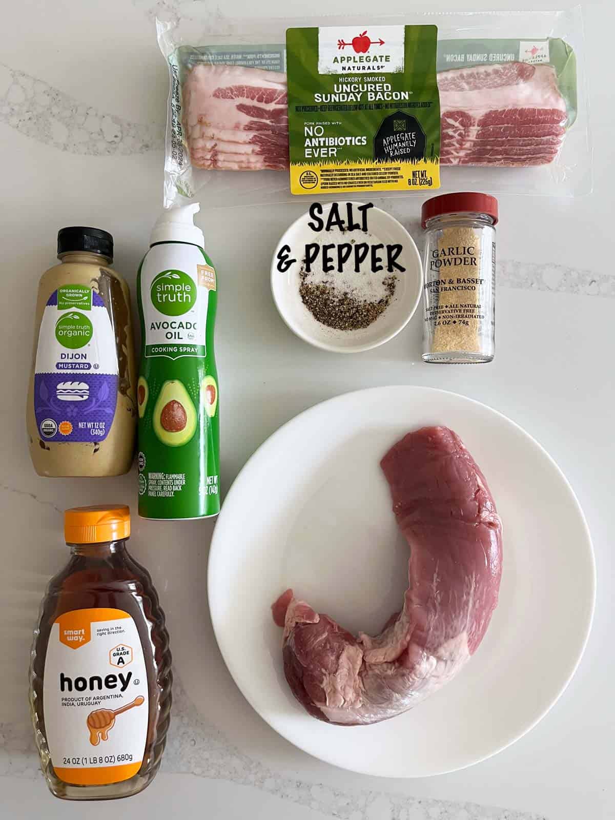 The ingredients needed to make a bacon-wrapped pork tenderloin.