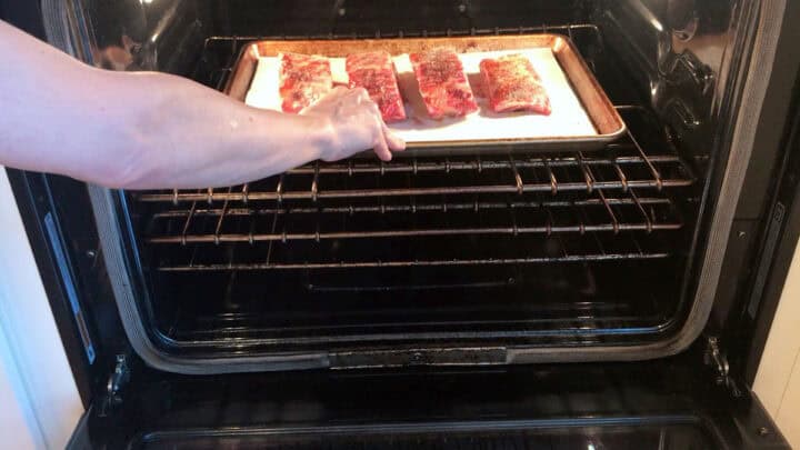 Placing the ribs in the oven.