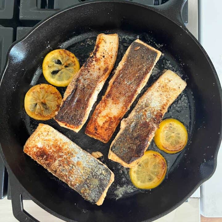 The salmon pieces were turned in the skillet skin side up.
