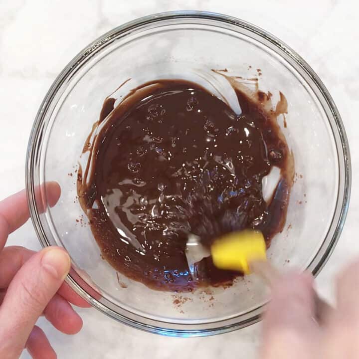 Mixing in cocoa powder.