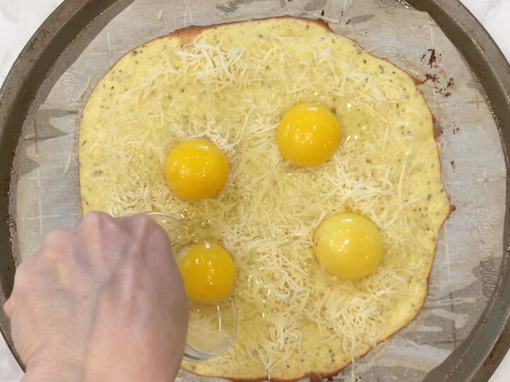 Adding eggs to the baked crust.