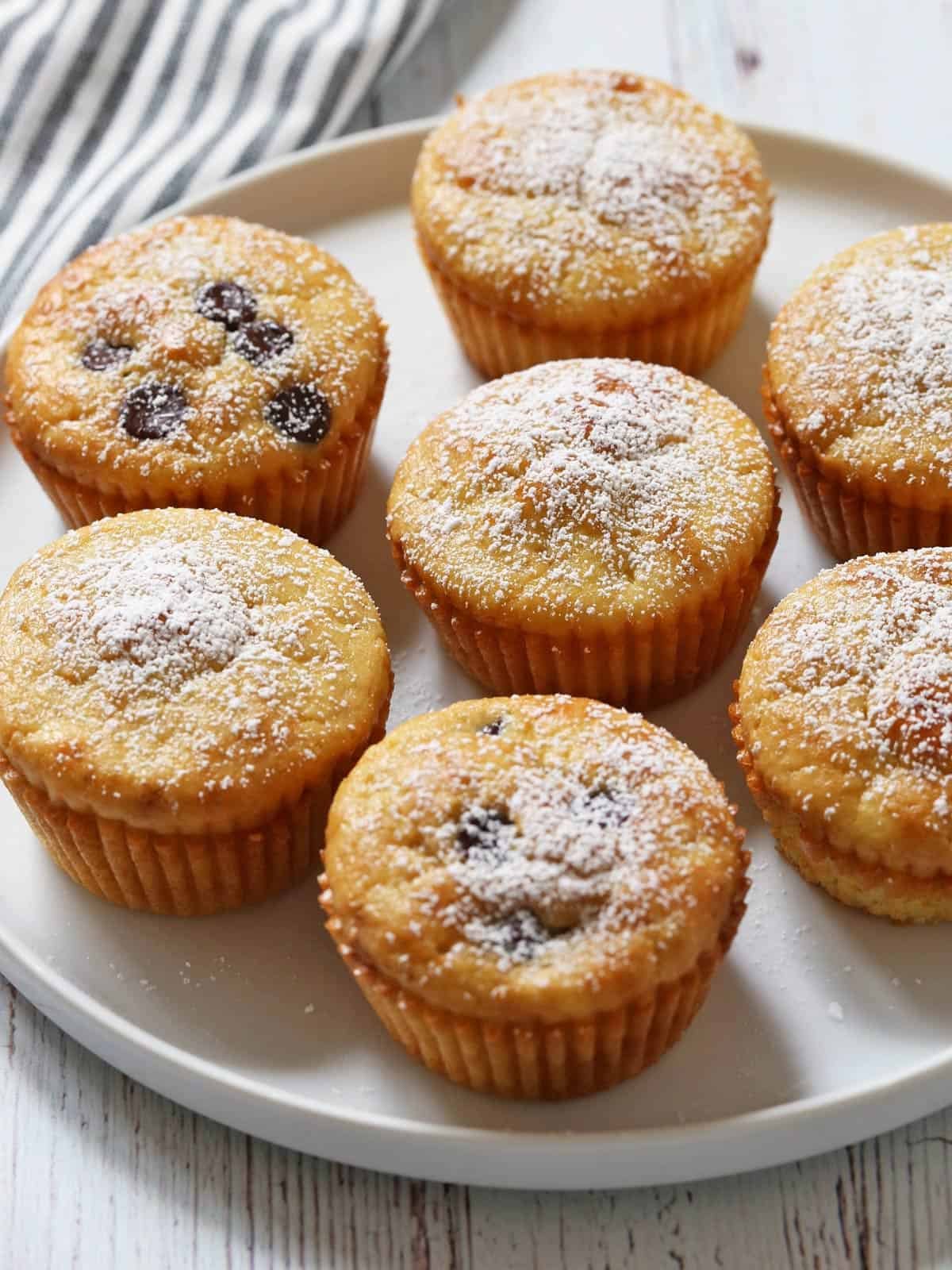 Almond flour muffins are served on a white plate.