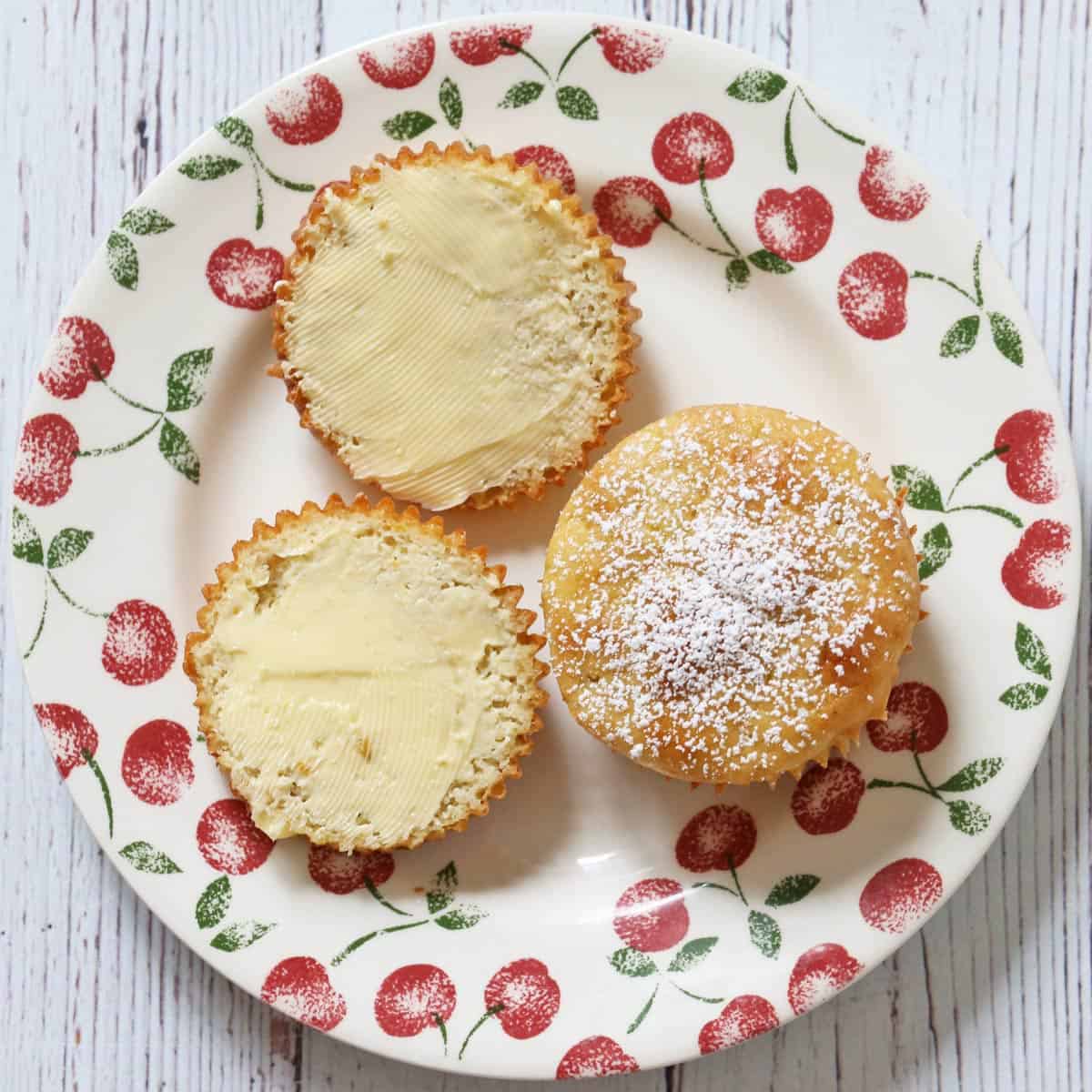 Almond flour muffins are topped with butter.