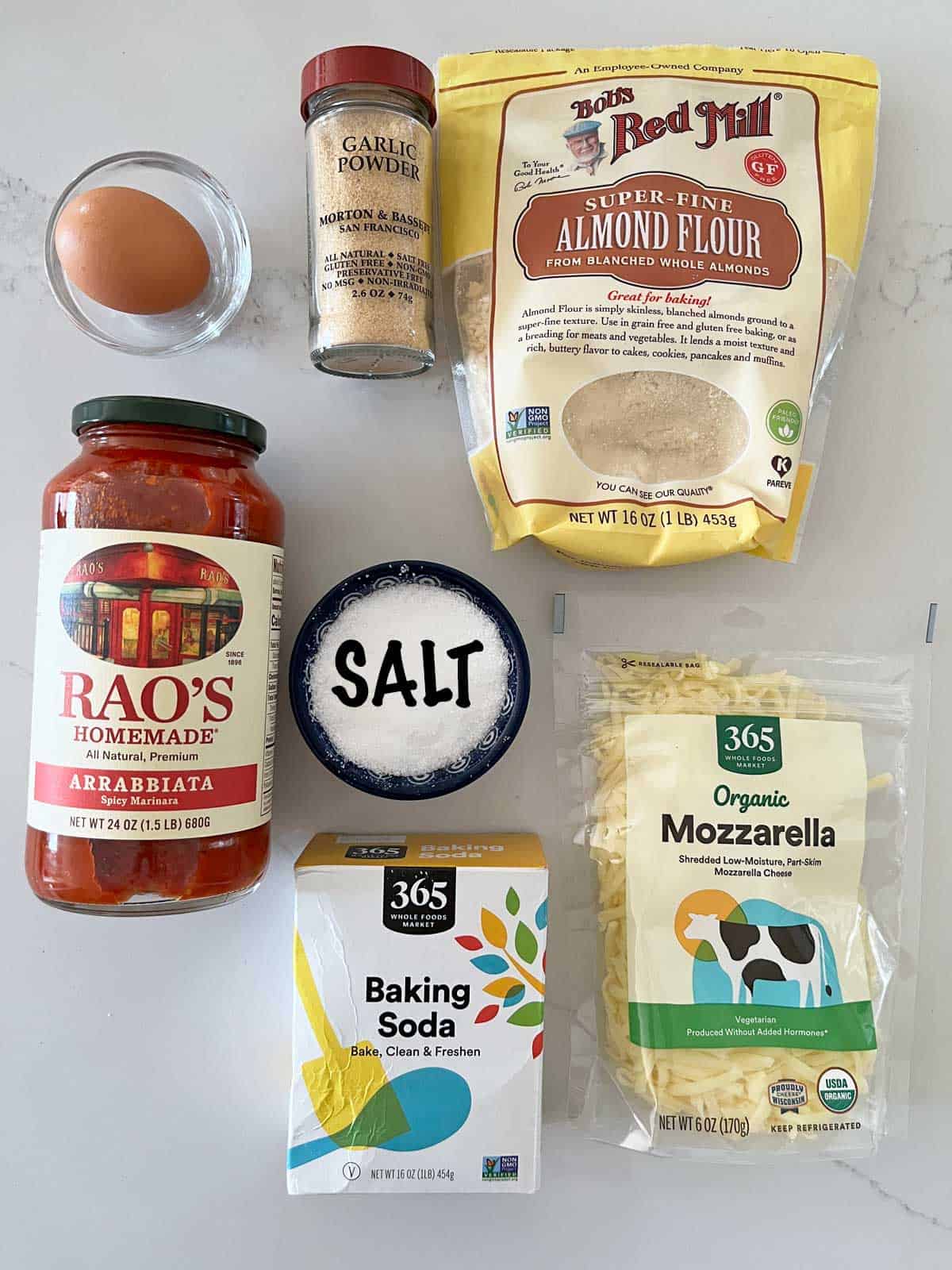 The ingredients needed to make an almond flour pizza crust.