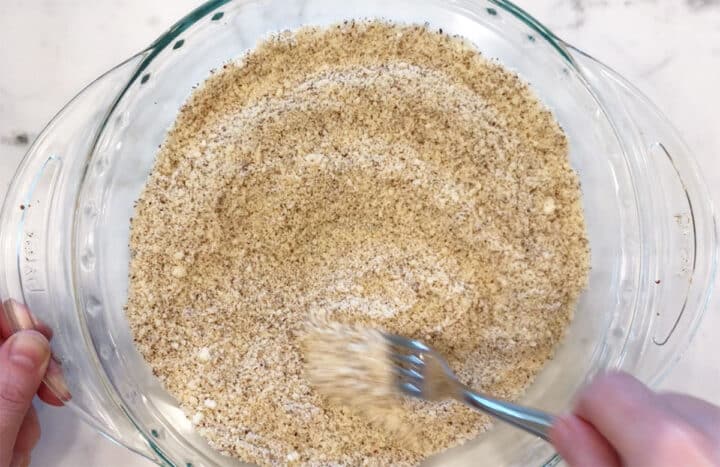 Mixing the almond meal and parmesan.