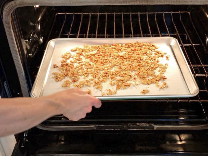Placing the pan in the oven.
