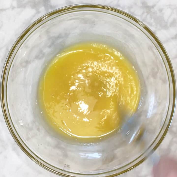 Mixing melted butter, stevia, vanila, and salt.