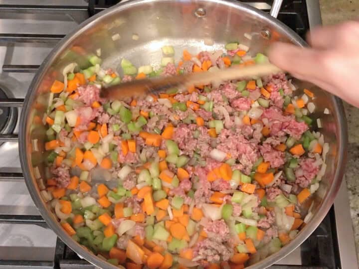 Stirring the beef and vegetables.