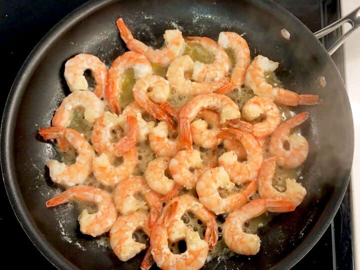 Cooking shrimp in butter.