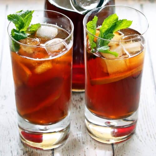 Iced tea garnished with mint leaves.
