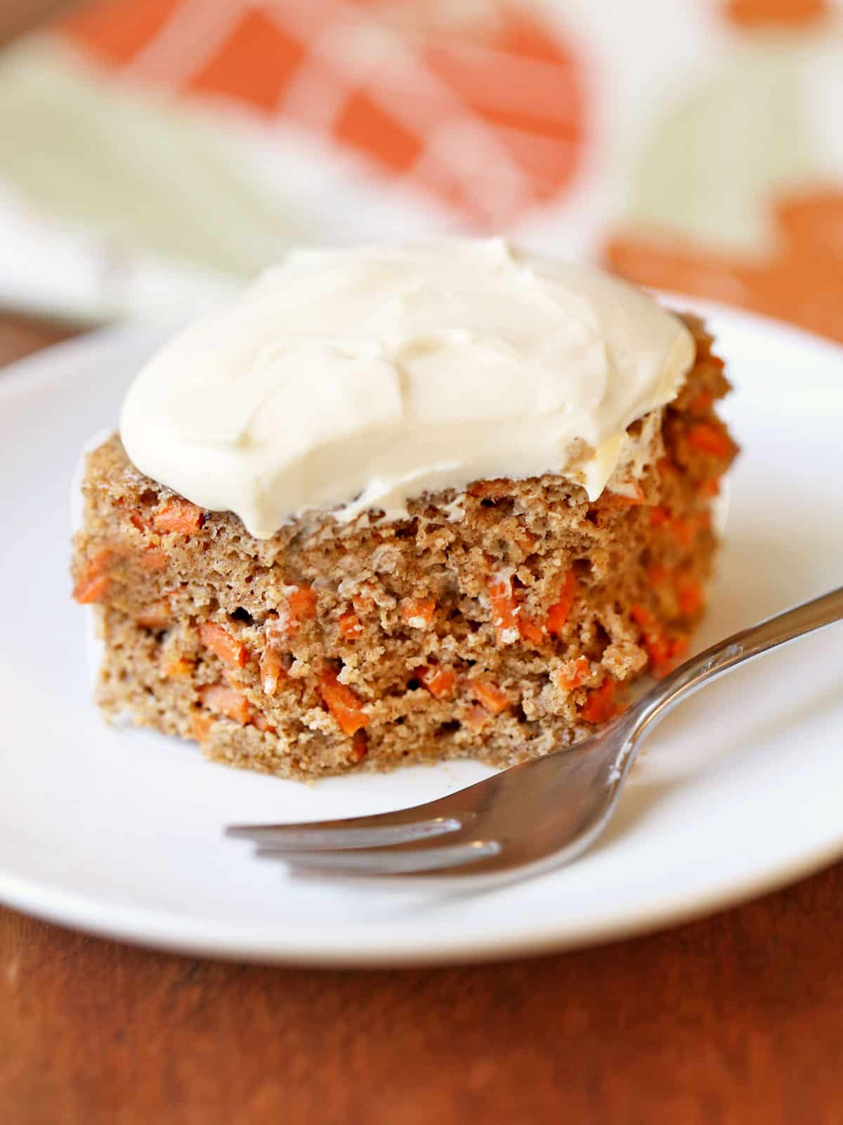 A slice of keto carrot cake on a plate.